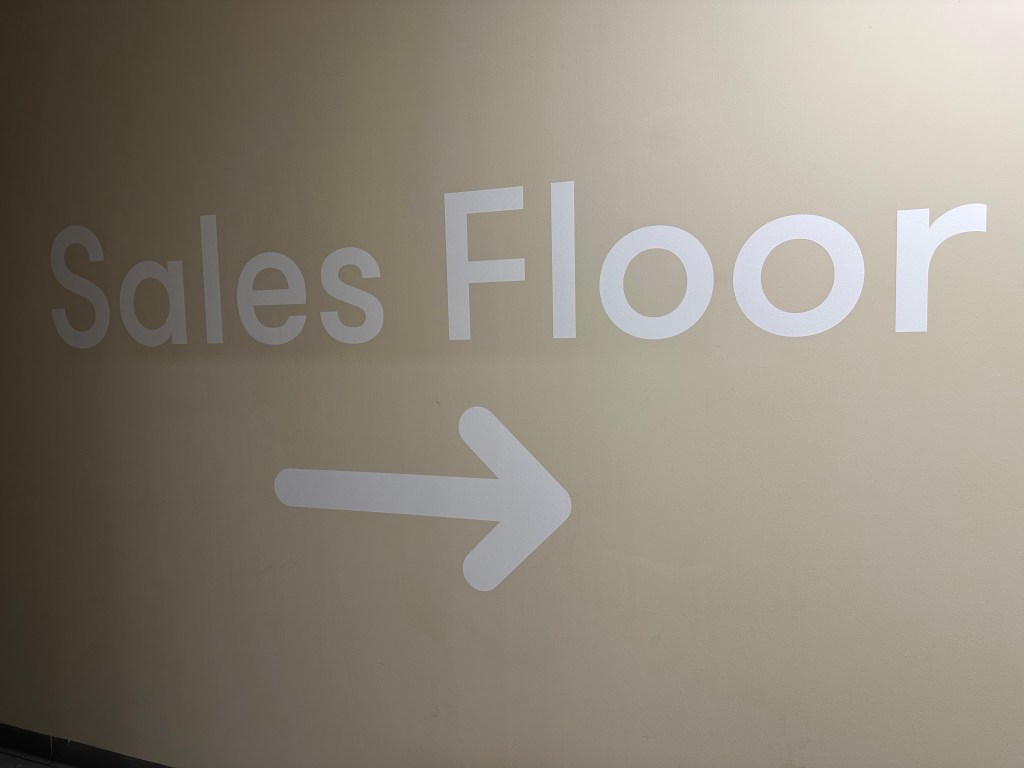 Clear directions applied to the wall in large lettering for customers to find their way back to the store.