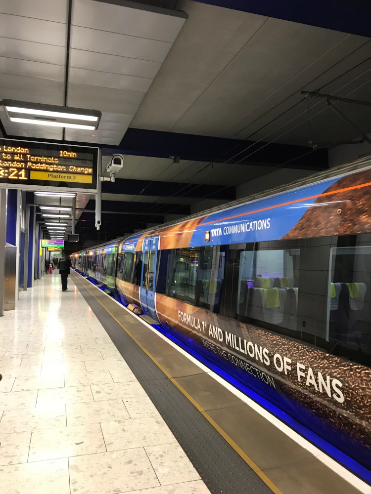 A Heathrow Express Train standing at a platform of Terminal Five's railway station.